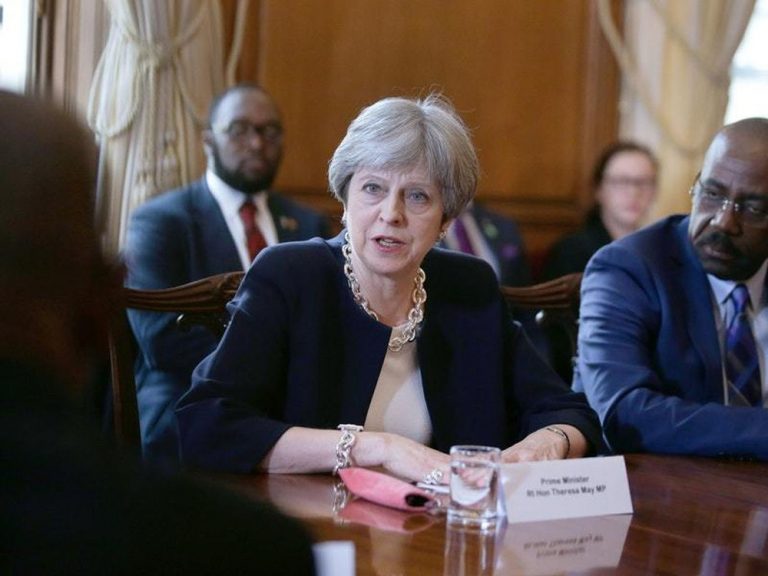 Theresa May extends apology over Windrush deportation scandal